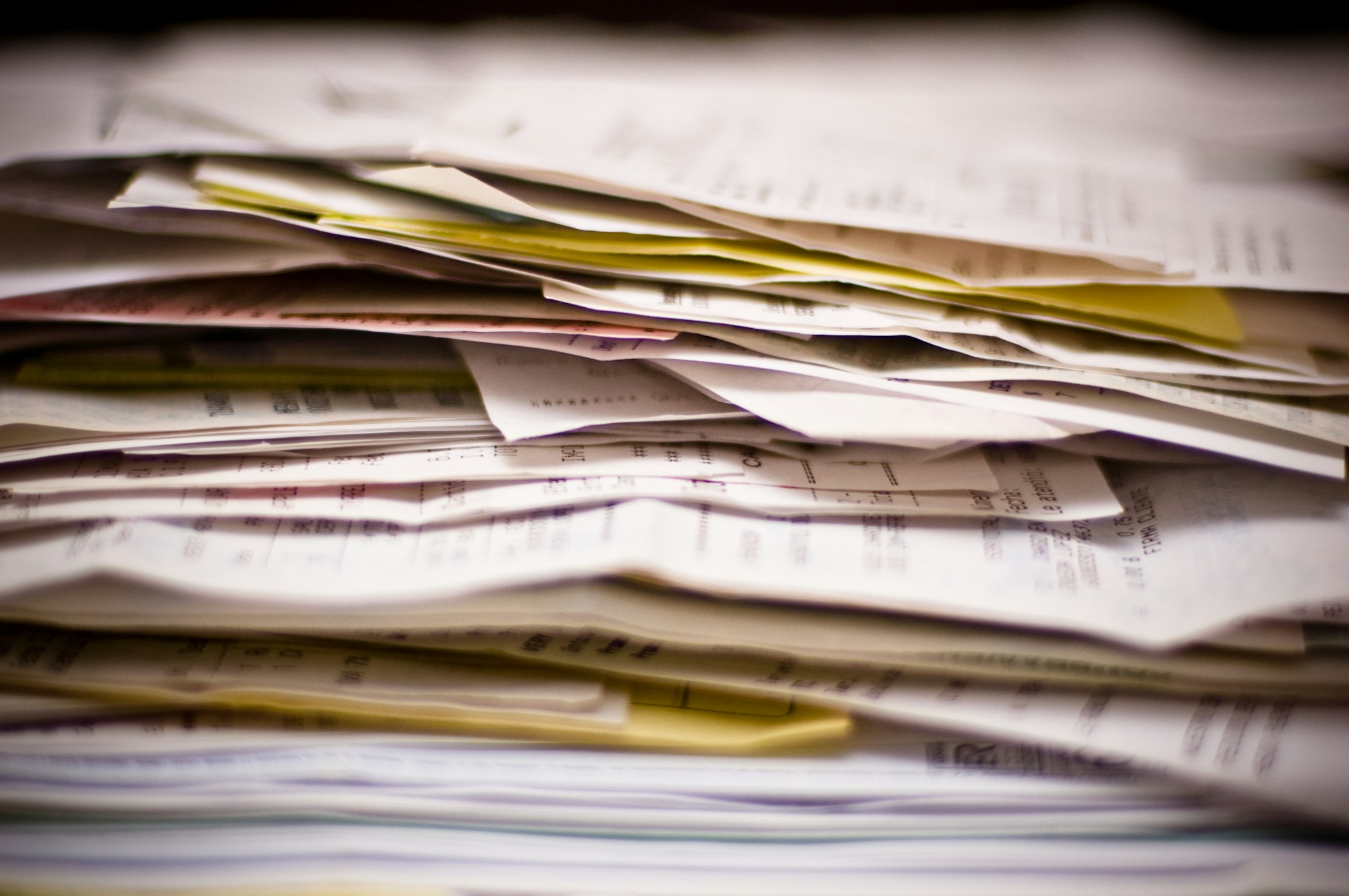 A thick stack of receipts and business papers